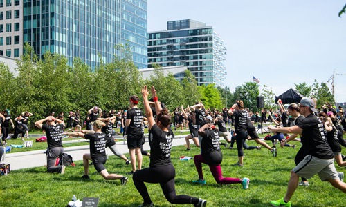 Public spartan training with trainees stretching